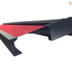 Czarna konstrukcja oraz lekko wysunięte czerwone poszycie markizy Quadra ukazane na białym tle.