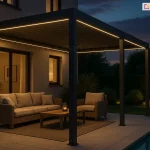 Stylowa pergola Marlo w wersji ściennej – zadaszenie tarasu z oświetleniem LED i elektrycznym dachem lamelowym osłaniająca meble wypoczynkowe na tarasie.