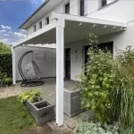 Pergola Aura z rozwijanym dachem tkaninowym w wersji montowanej do ściany