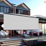 Piętrowy domek przy plaży, którego okna przesłaniają żaluzje fasadowe. Niewielki taras, dzięki składanej ścianie zewnętrznej łączy się z wnętrzem domku. Pod zawieszoną na tarasie markizą Jamaica Selt z długą rozwijaną falbaną widoczny jest ustawiony w głębi biały okrągły stół z krzesłami, leżak drewniany oraz kanapa z lampką o stojący przed nią stolik. Szara tkanina falbany volant oznaczona została pośrodku białym okrągłym znacznikiem, od którego poprowadzono zieloną kreskę do umieszczonego na szarym tle w prawym dolnym rogu napisu "rozwijana (do 120cm) falbana Volant".